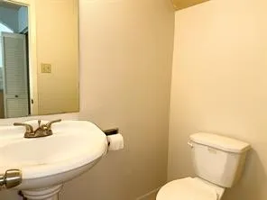 a kitchen with granite countertop a sink a stove and a refrigerator