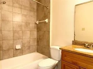 a bathroom with a shower and toilet