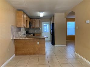 10064 Emnora Lane Houston, TX 77080 - Photo 4 of 31 a kitchen with stainless steel appliances granite countertop a refrigerator and a sink