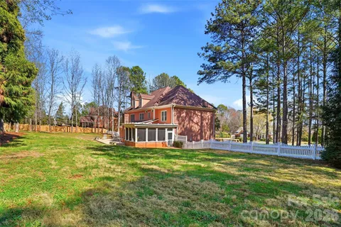 a view of a house with a big yard