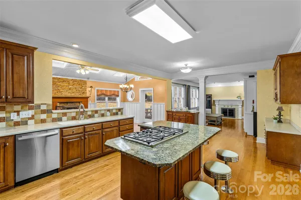 a kitchen with lots of counter top space and stainless steel appliances