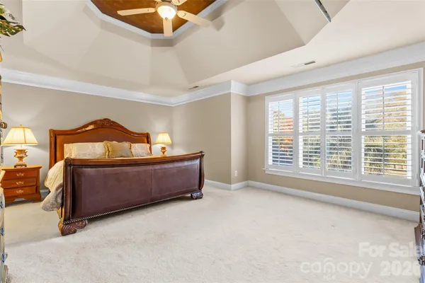 a bedroom with furniture and window