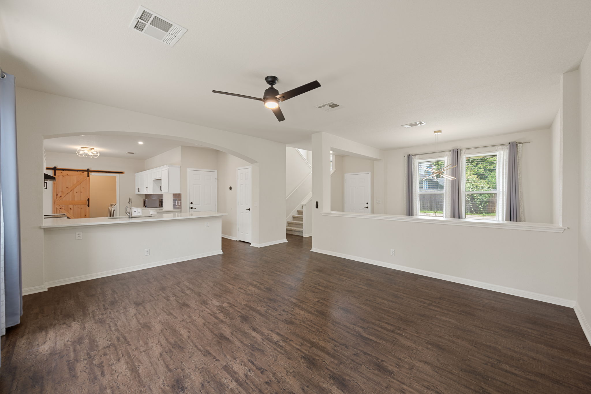 8902 Magna Carta Loop, Unit 122 Austin, TX 78754 - Photo 38 of 39 An open floorplan seamlessly connects the living area with a well-appointed kitchen.