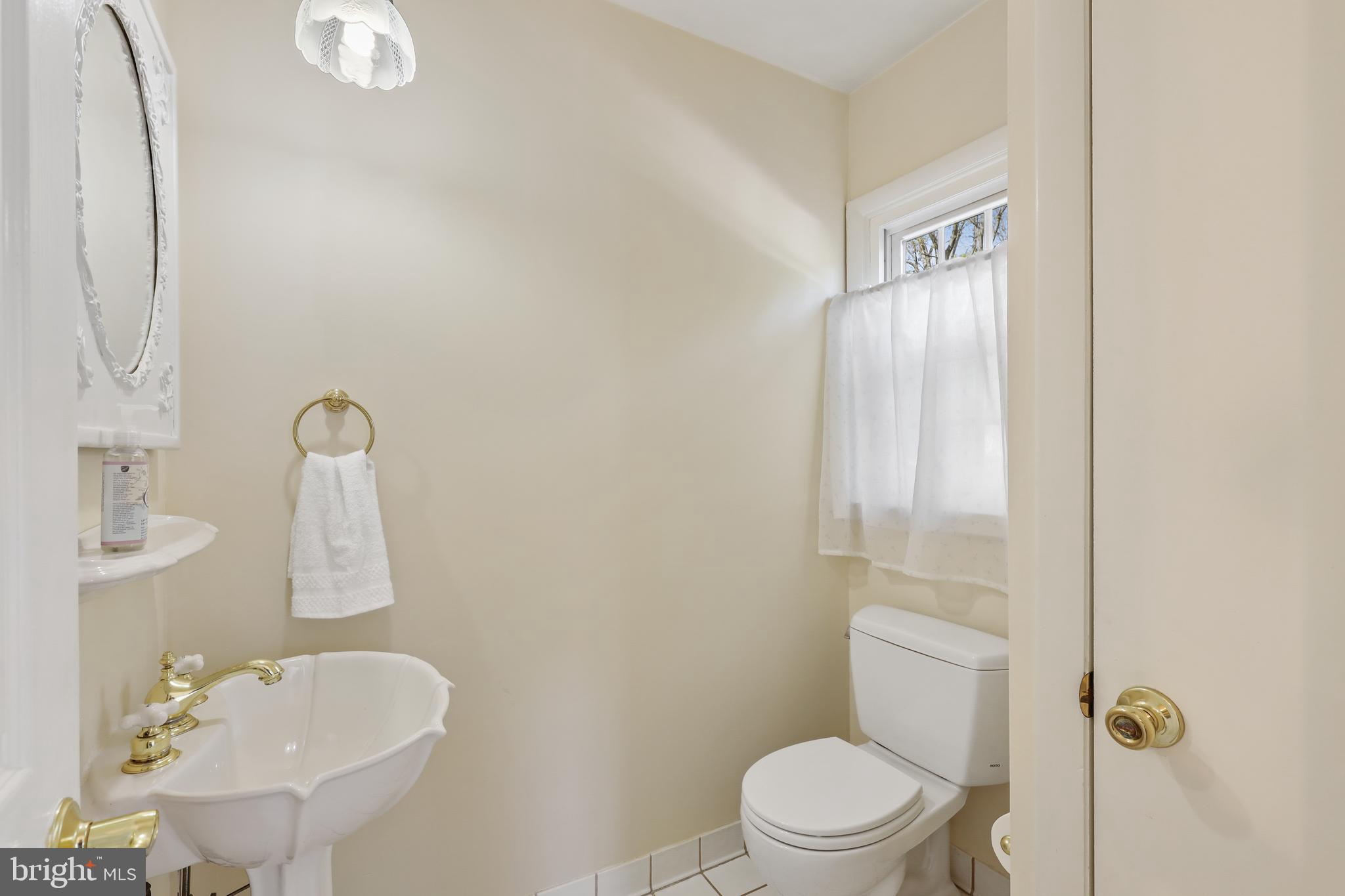2913 Southview Road Ellicott City, MD 21042 - Photo 21 of 38 Half bathroom next to family room