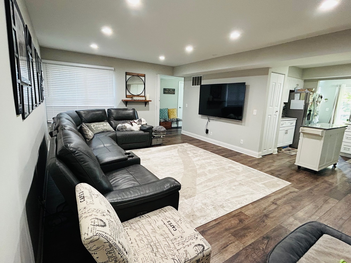 2372 County Farm Lane, Unit E214 Schaumburg, IL 60107 - Photo 5 of 19 a living room with furniture and a flat screen tv