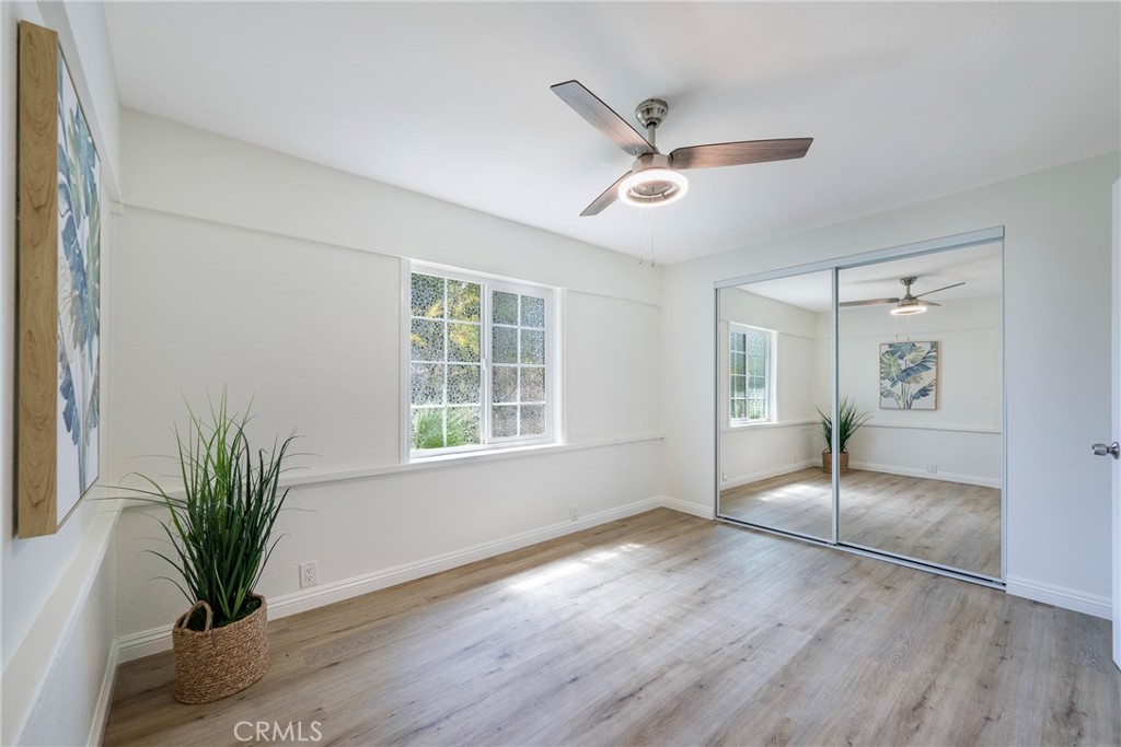 3751 McKenzie Street Riverside, CA 92503 - Photo 19 of 68 a view of empty room with wooden floor and fan