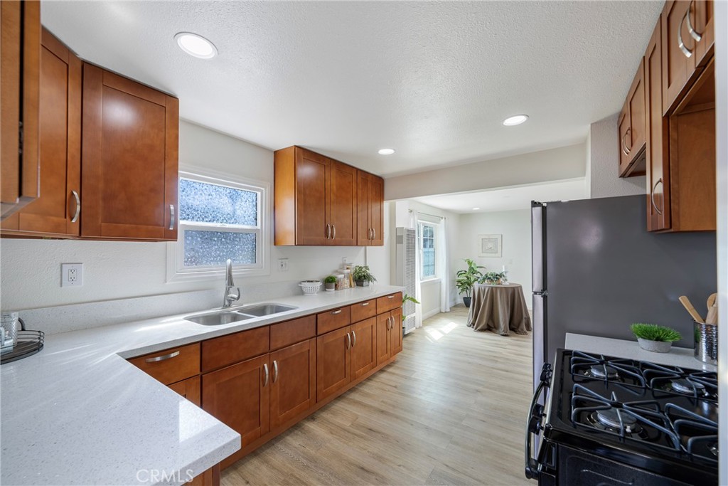 3751 McKenzie Street Riverside, CA 92503 - Photo 23 of 68 a kitchen with stainless steel appliances granite countertop a sink stove and refrigerator