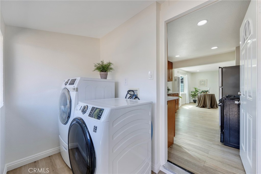 3751 McKenzie Street Riverside, CA 92503 - Photo 39 of 68 a view of a hallway with washer and dryer