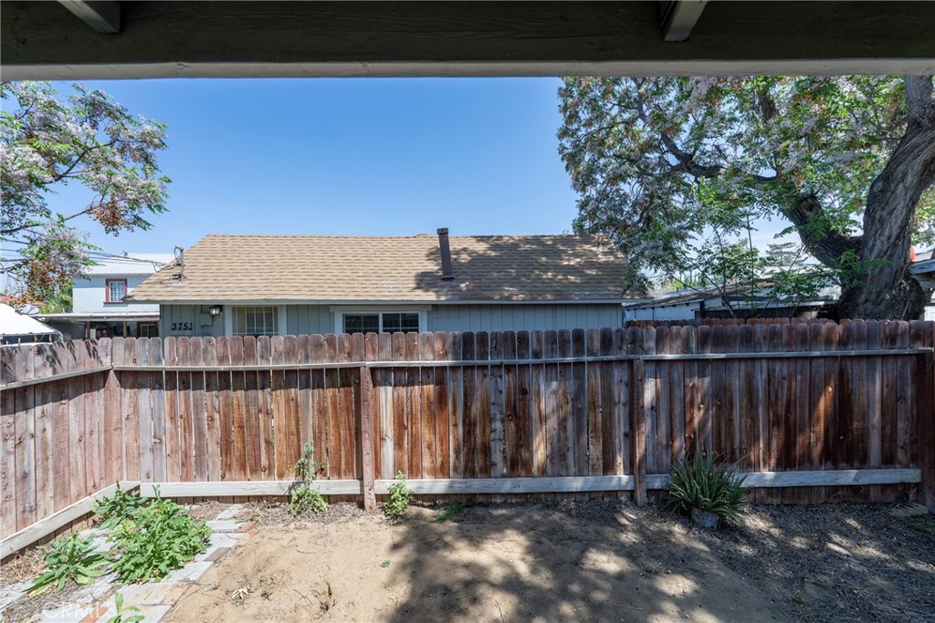 3751 McKenzie Street Riverside, CA 92503 - Photo 41 of 68 a front view of a house with a garden