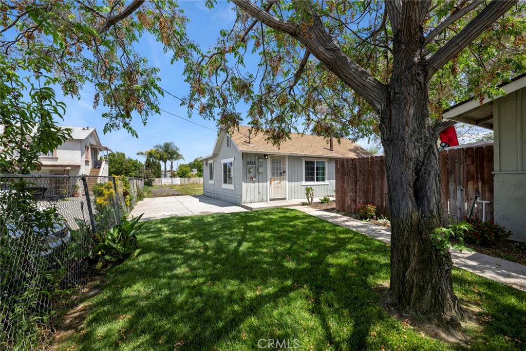 3751 McKenzie Street Riverside, CA 92503 - Photo 45 of 68 a front view of a house with garden