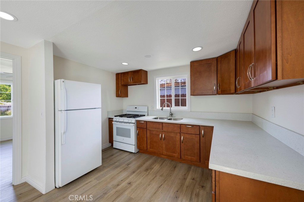 3751 McKenzie Street Riverside, CA 92503 - Photo 48 of 68 a kitchen with stainless steel appliances granite countertop a refrigerator sink and cabinets