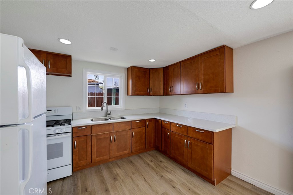 3751 McKenzie Street Riverside, CA 92503 - Photo 49 of 68 a kitchen with a sink cabinets and stainless steel appliances