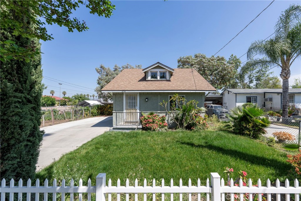 3751 McKenzie Street Riverside, CA 92503 - Photo 5 of 68 a front view of a house with a yard