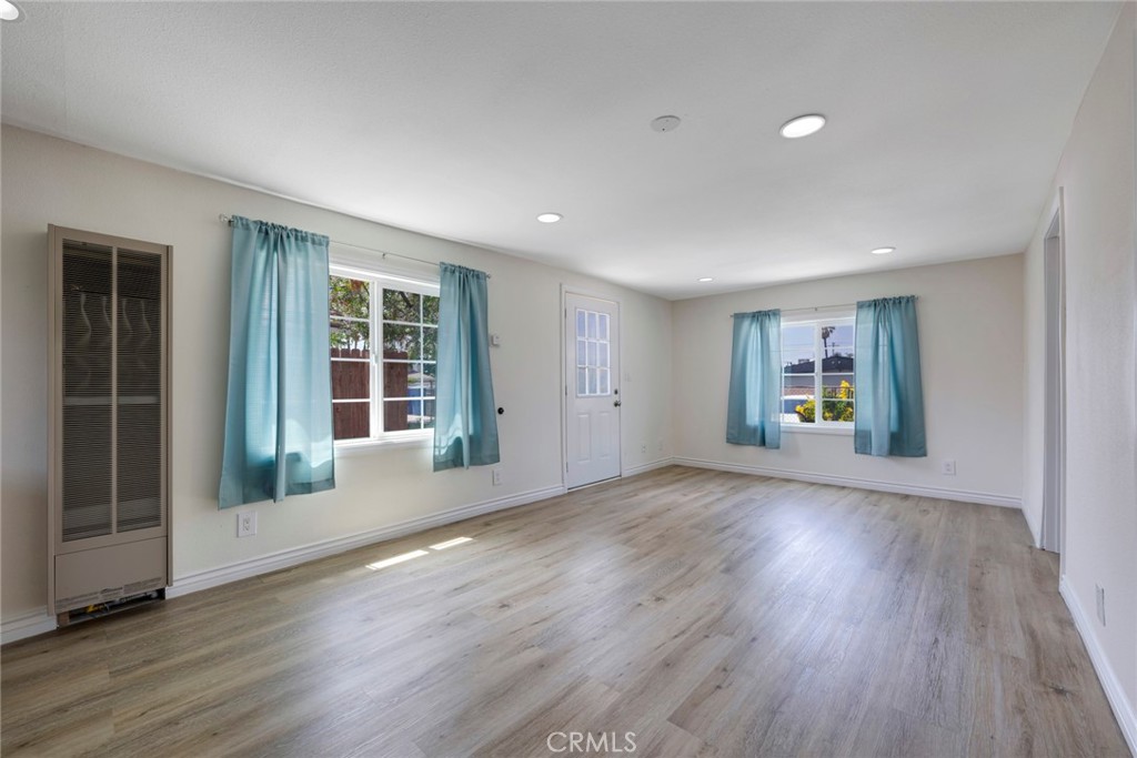 3751 McKenzie Street Riverside, CA 92503 - Photo 54 of 68 an empty room with wooden floor and windows