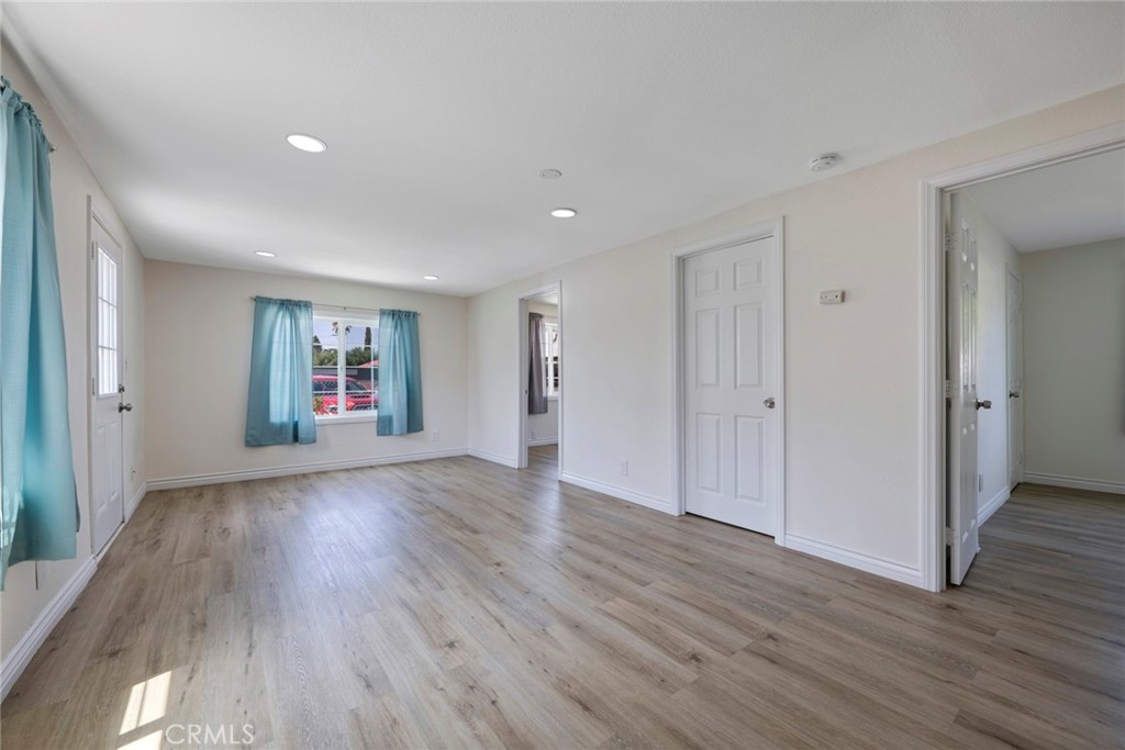 3751 McKenzie Street Riverside, CA 92503 - Photo 55 of 68 a view of a big room with wooden floor and windows