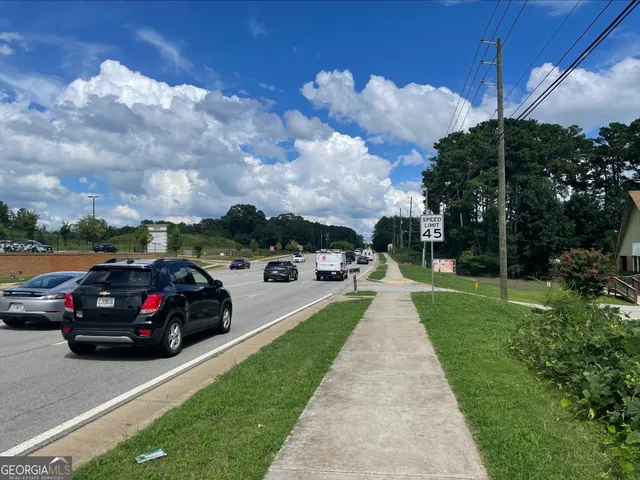 a view of street with parked cars