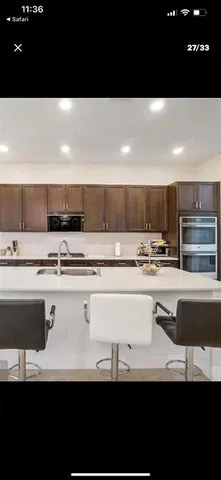 a view of kitchen with stainless steel appliances