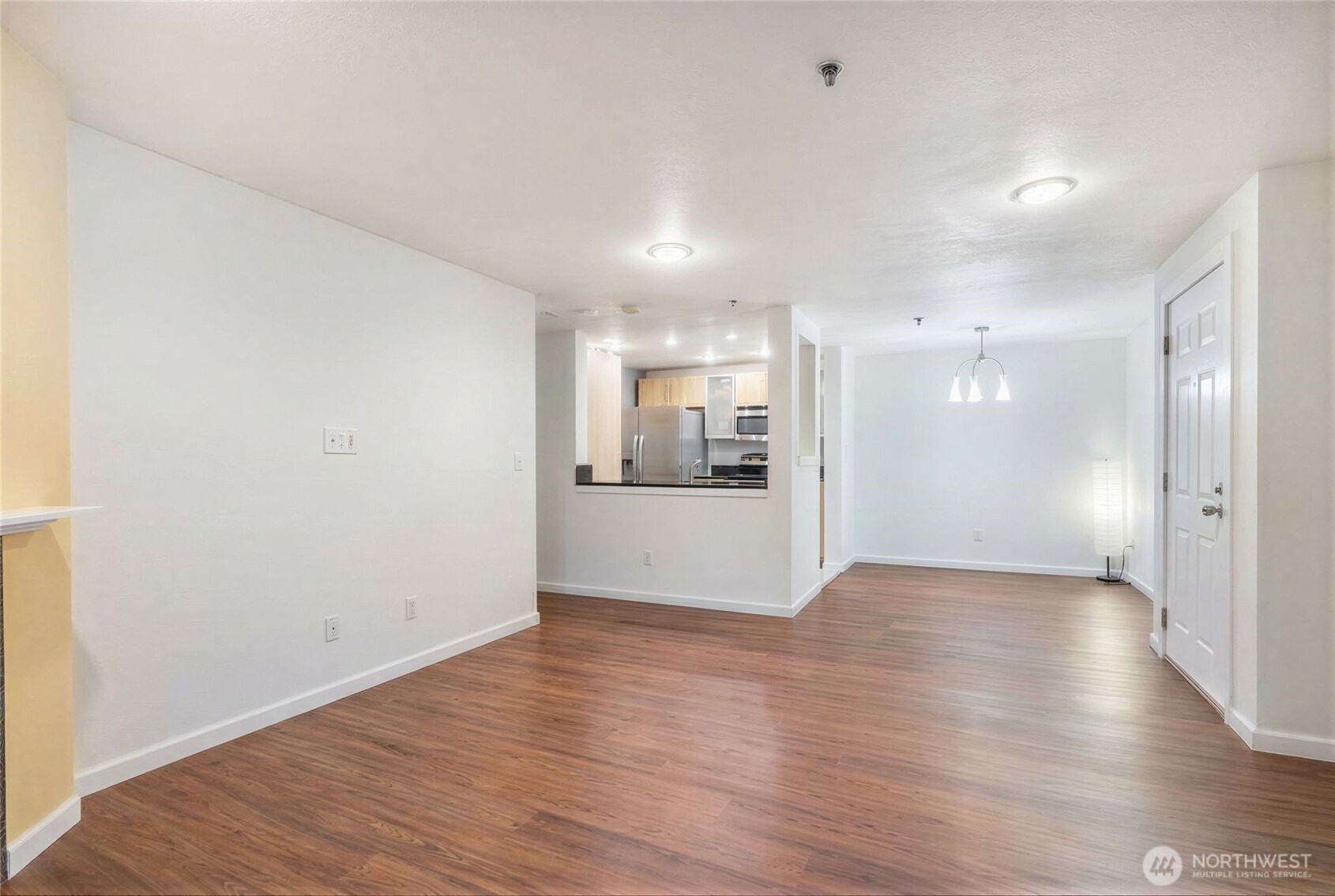 975 Aberdeen Avenue Northeast, Unit F207 Renton, WA 98056 - Photo 7 of 24 a view of an empty room with wooden floor
