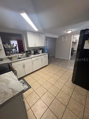 a kitchen with a sink and cabinets