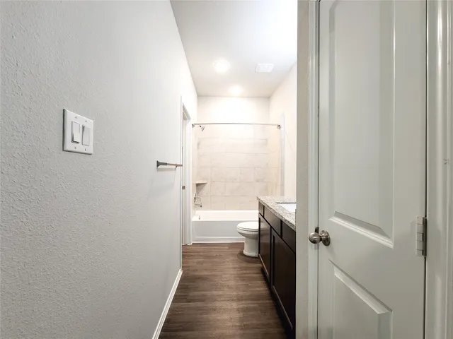 a view of a bathroom from the hallway