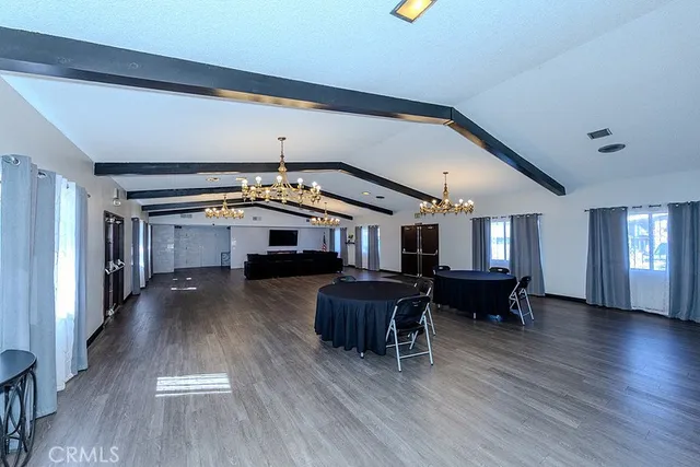 a living room with furniture and a piano