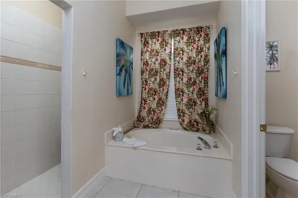 a bathroom with a bathtub and shower