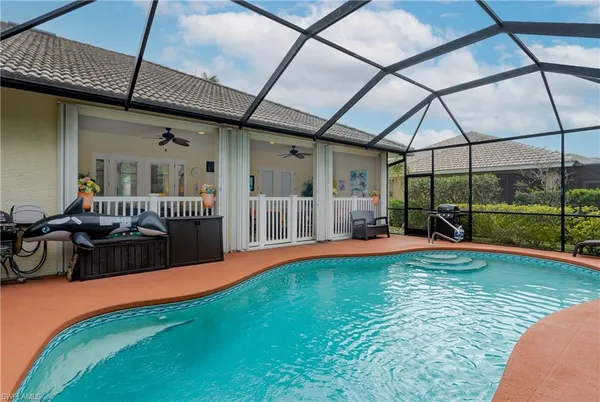 a view of swimming pool with seating space and furniture