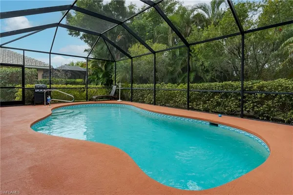 a view of a backyard with swimming pool