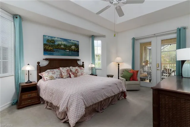 a bedroom with bed and a chandelier