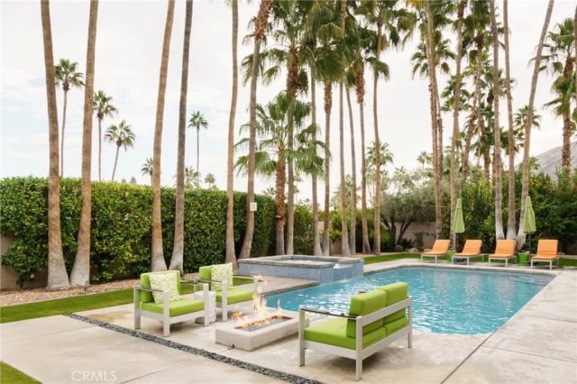 a view of a swimming pool with a lounge chairs