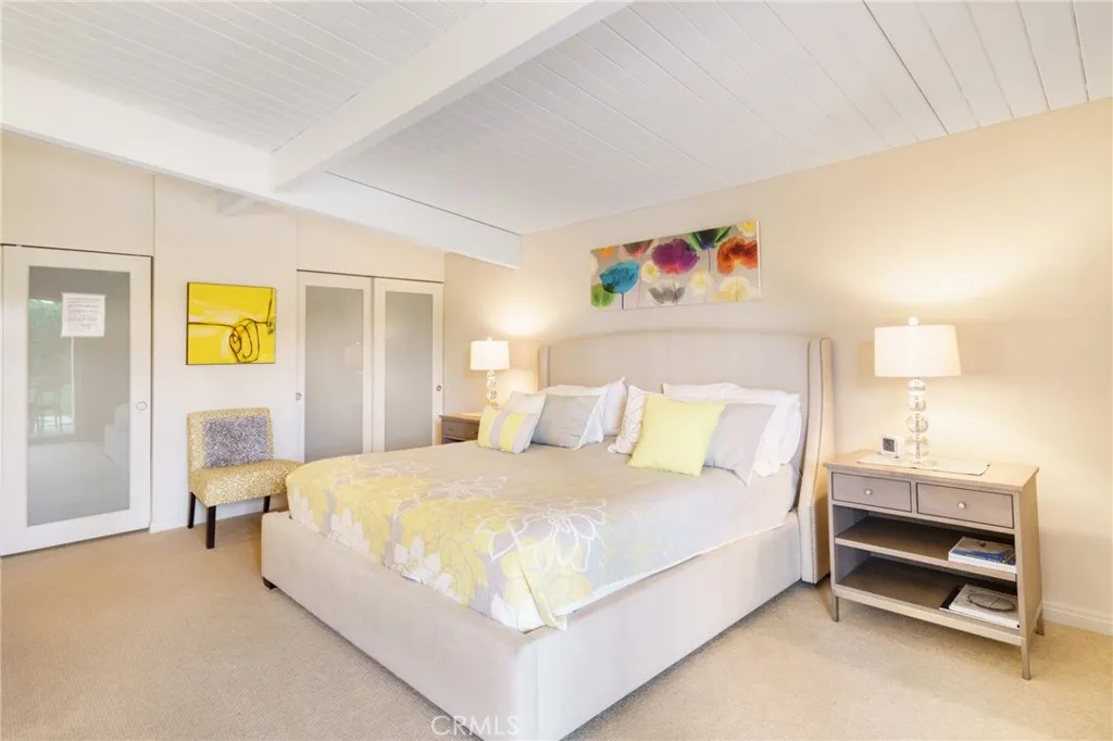 1134 Abrigo Road Palm Springs, CA 92262 - Photo 9 of 12 a bedroom with a bed and a window