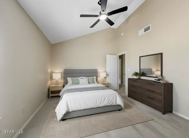 a bedroom with a bed and a mirror