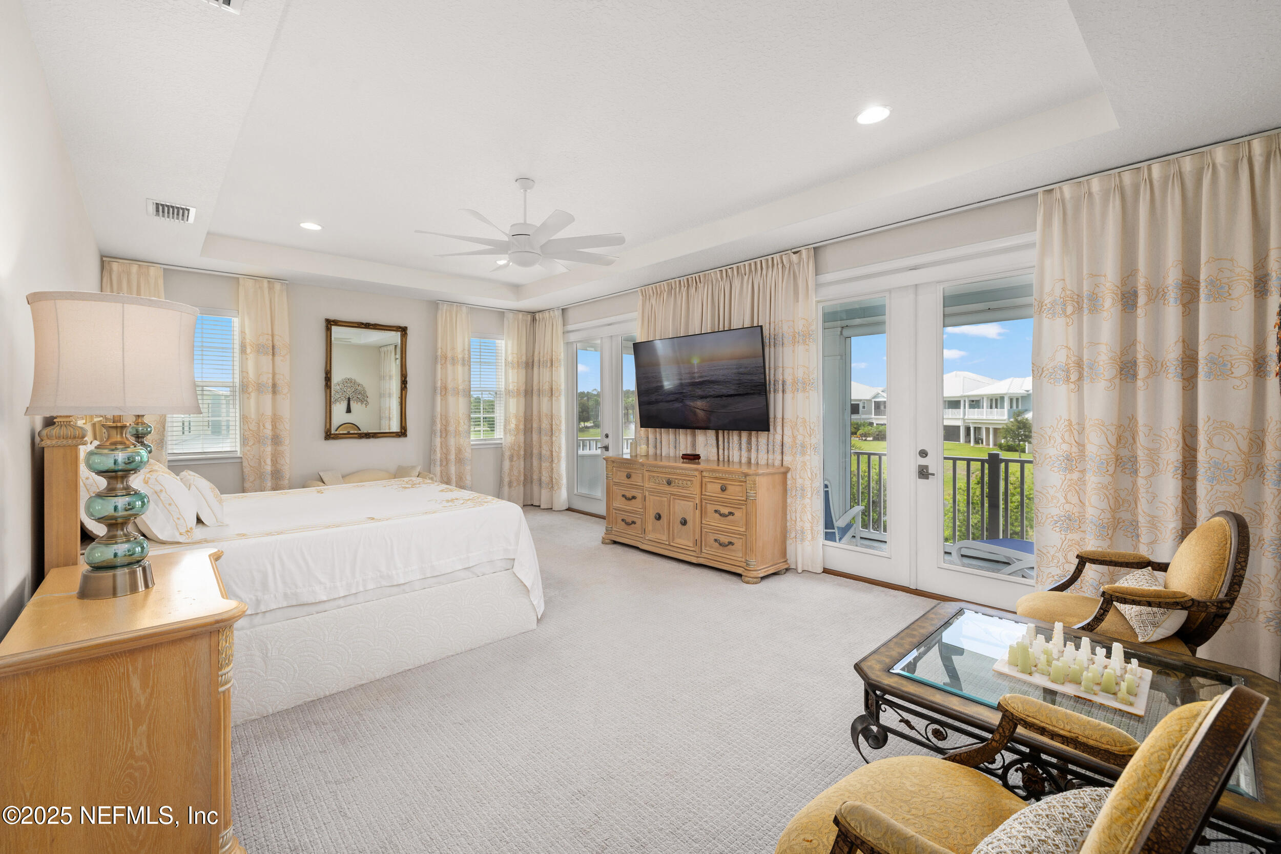 651 Rum Runner Way St. Johns, FL 32259 - Photo 49 of 97 a bedroom with furniture and a flat screen tv