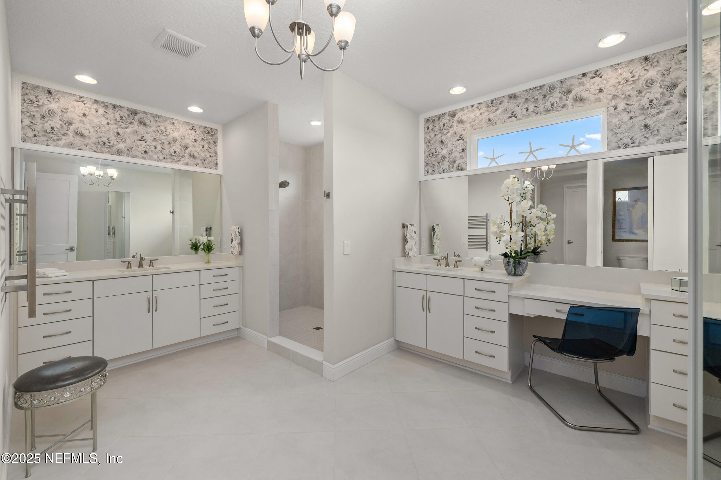 651 Rum Runner Way St. Johns, FL 32259 - Photo 55 of 97 a large bathroom with a sink a large mirror and a shower