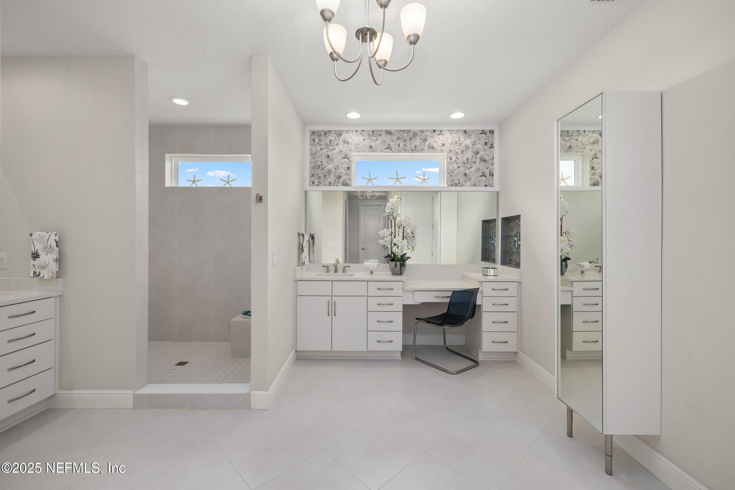 651 Rum Runner Way St. Johns, FL 32259 - Photo 56 of 97 a bathroom with a granite countertop sink a mirror and shower