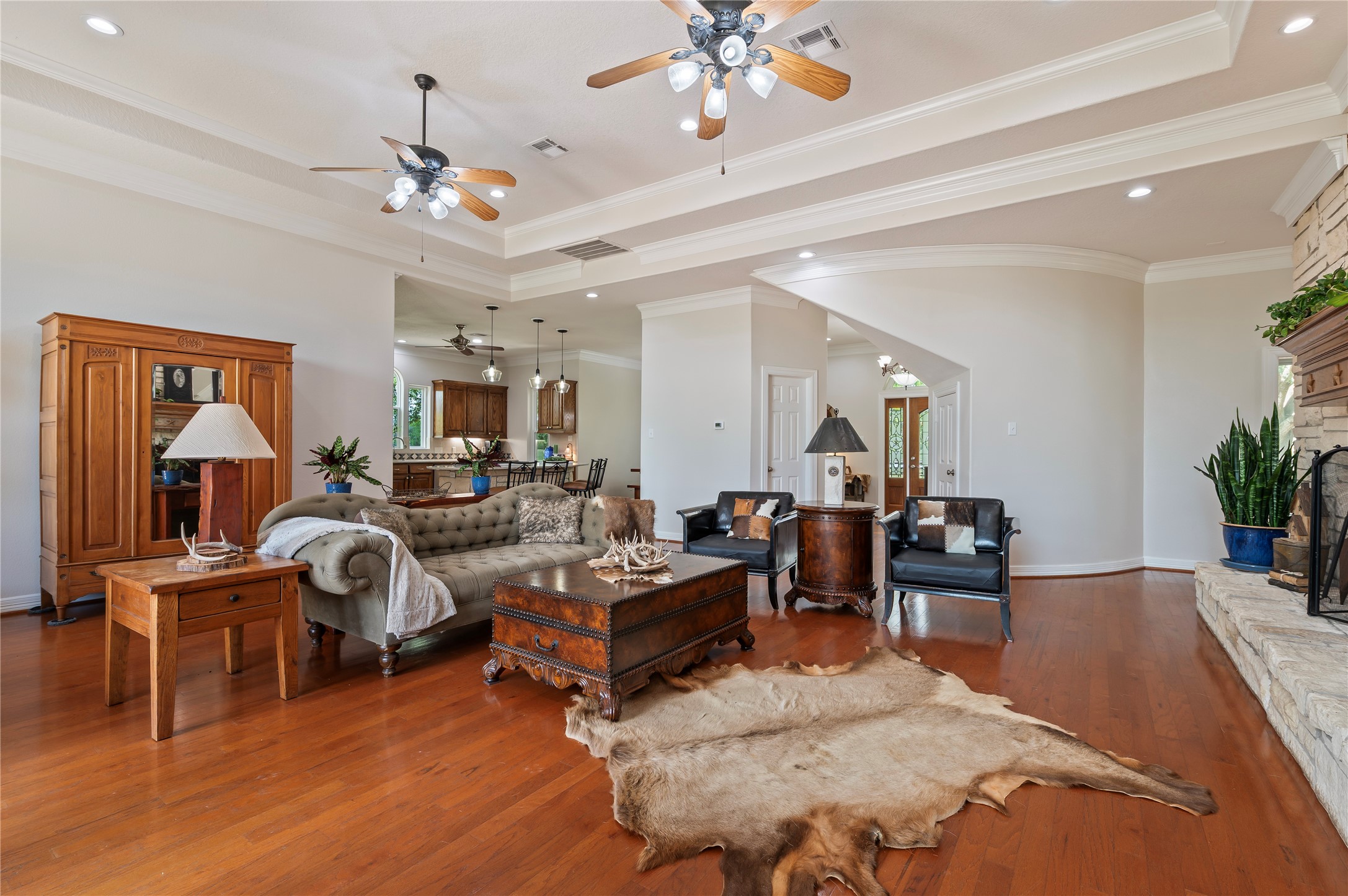 8211 Deats Lane Dickinson, TX 77539 - Photo 27 of 50 a living room with furniture a chandelier and a dining table