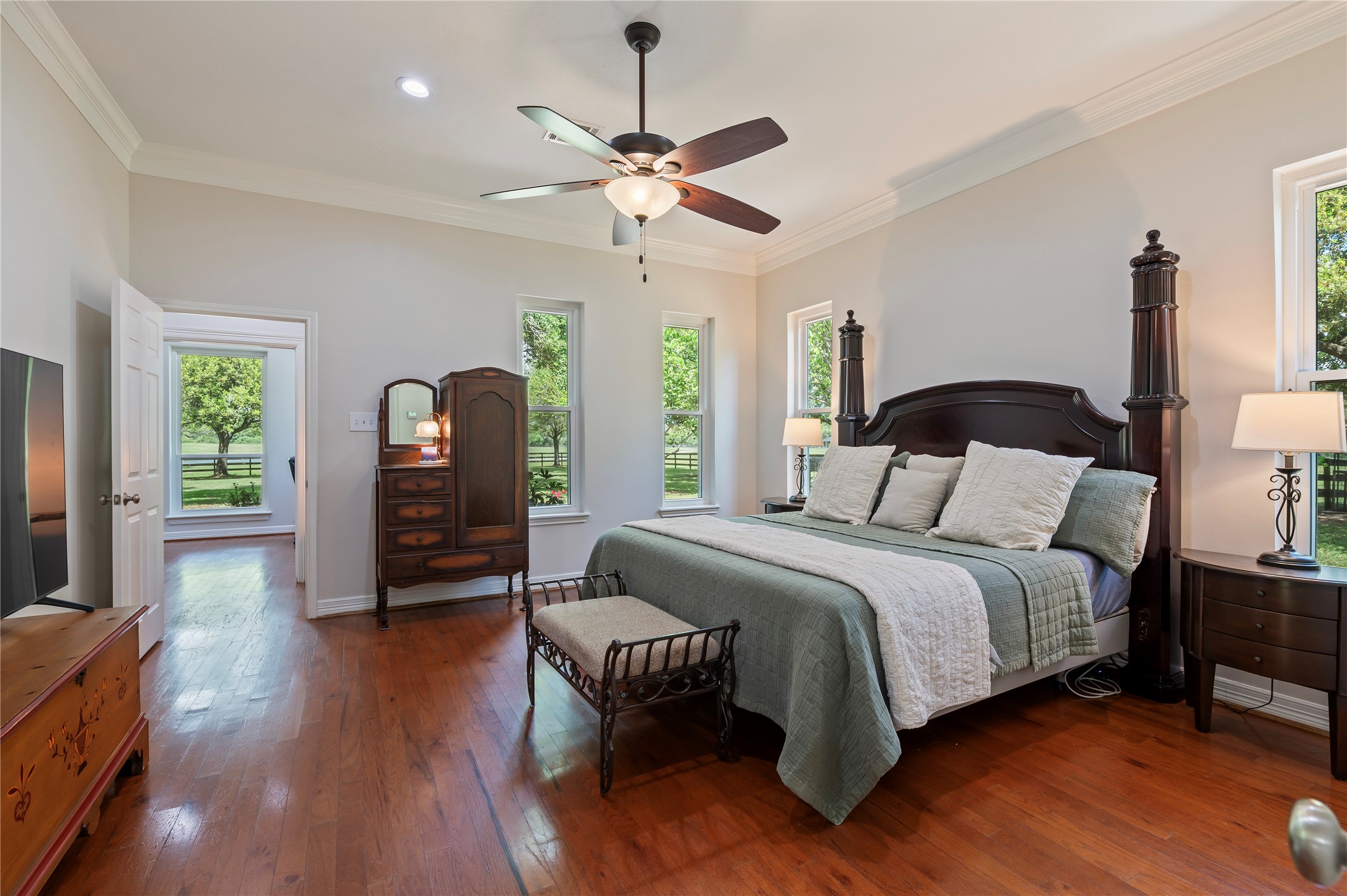 8211 Deats Lane Dickinson, TX 77539 - Photo 29 of 50 a bedroom with a bed and wooden floor