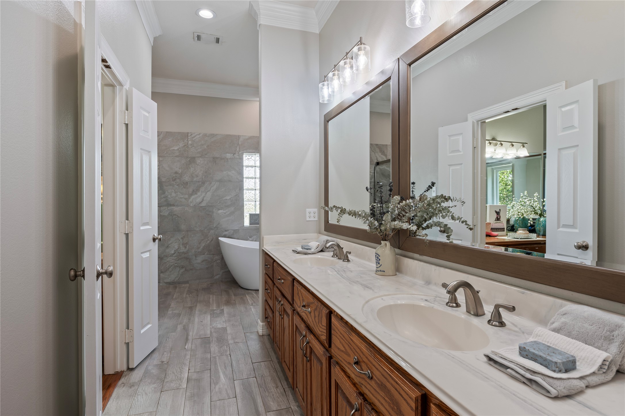 8211 Deats Lane Dickinson, TX 77539 - Photo 30 of 50 a bathroom with a sink double vanity and a mirror