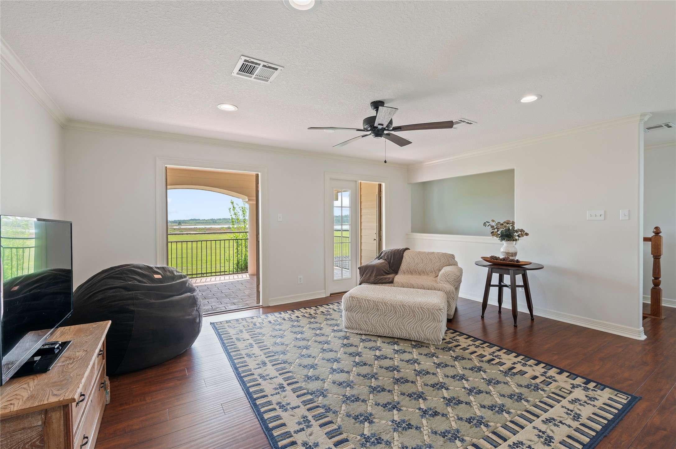 8211 Deats Lane Dickinson, TX 77539 - Photo 33 of 50 a living room with furniture and a wooden floor