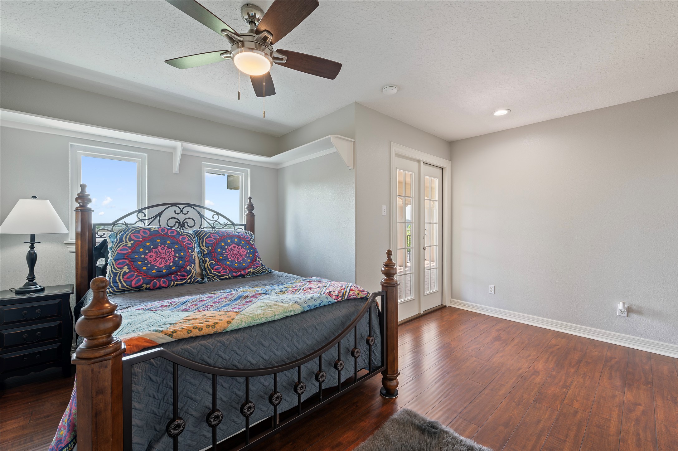 8211 Deats Lane Dickinson, TX 77539 - Photo 36 of 50 a bedroom with a bed and a chandelier