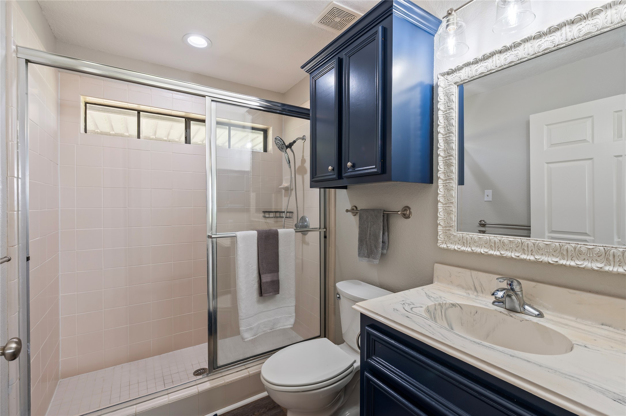 8211 Deats Lane Dickinson, TX 77539 - Photo 48 of 50 a bathroom with a sink toilet and shower