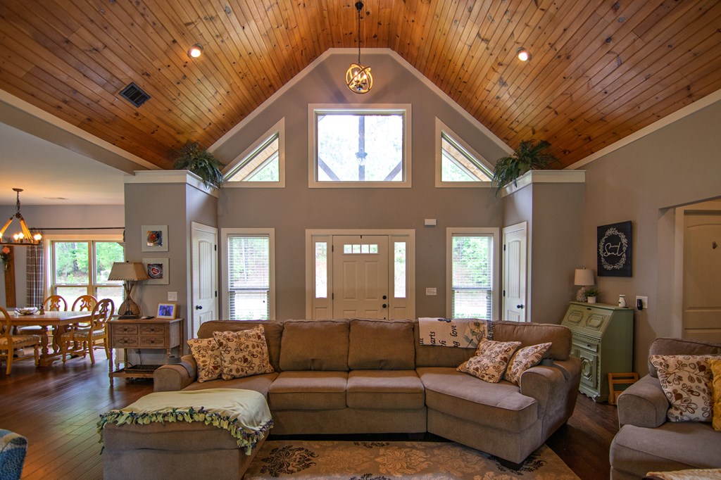 299 Savior Lane Hamilton, GA 31811 - Photo 17 of 92 a living room with furniture and a chandelier