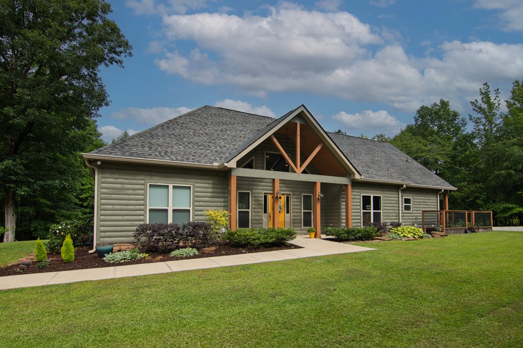 299 Savior Lane Hamilton, GA 31811 - Photo 5 of 92 a front view of a house with a yard