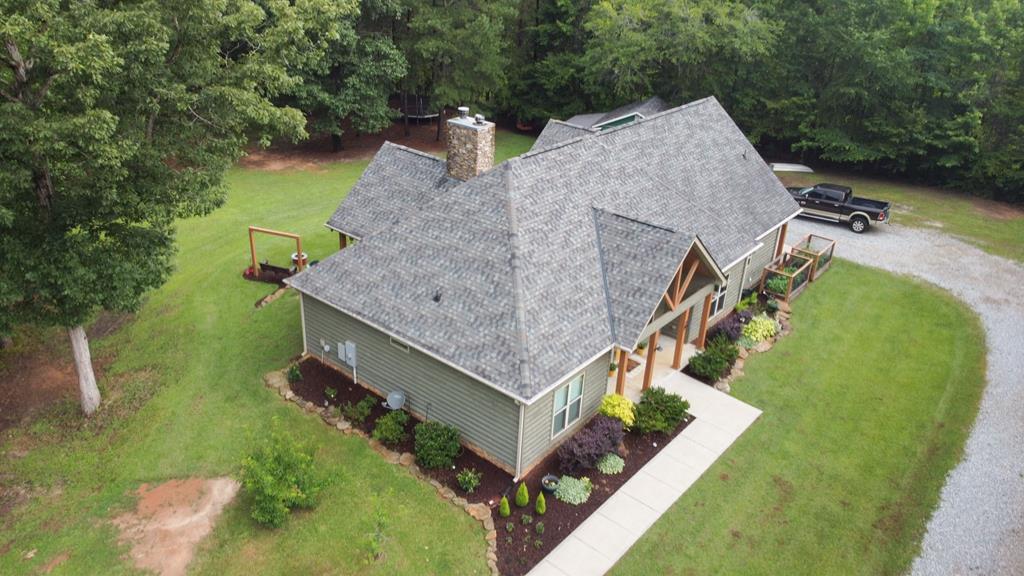 299 Savior Lane Hamilton, GA 31811 - Photo 86 of 92 an aerial view of a house with a yard and trees