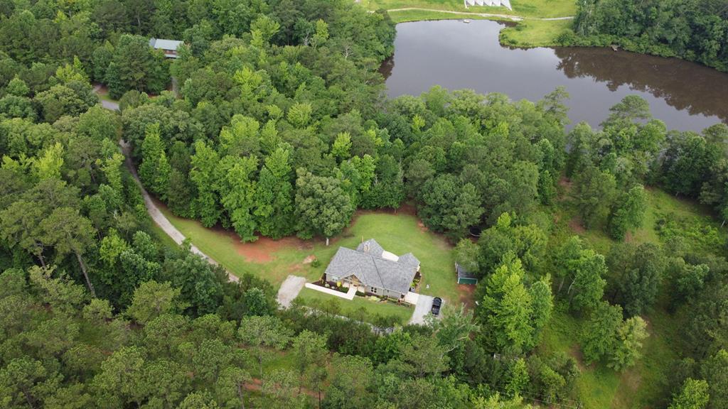 299 Savior Lane Hamilton, GA 31811 - Photo 90 of 92 an aerial view of a house with a yard and lake view