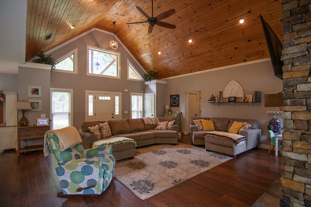 299 Savior Lane Hamilton, GA 31811 - Photo 9 of 92 a living room with furniture and a chandelier