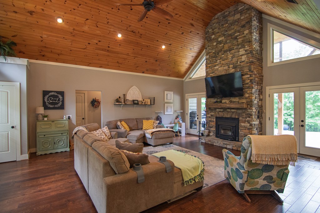 299 Savior Lane Hamilton, GA 31811 - Photo 10 of 92 a living room with furniture a fireplace and a flat screen tv
