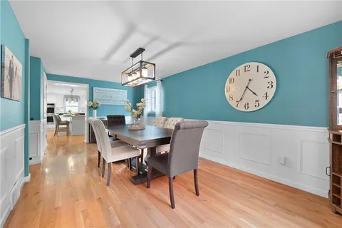 a bedroom with bed and white cabinets