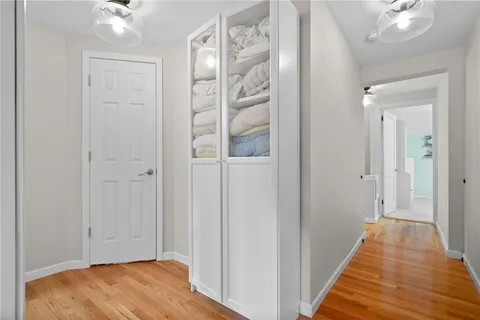 a view of a bedroom with furniture and window