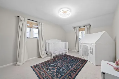 a living room with furniture and flowers